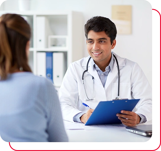 smiling doctor with clipboard and patient at hospital